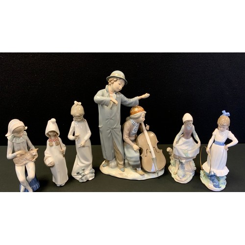 134 - A Lladro figure Curtsy Girl & Rabbit;  another Nightdress;  others Nao Hoopla etc another larger Zia... 