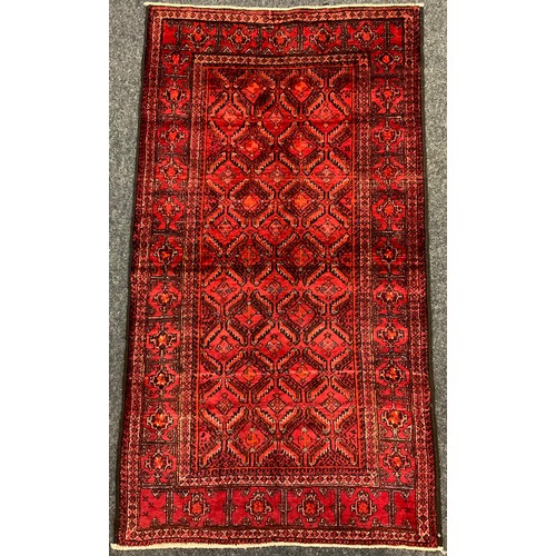 154 - A North-East Persian Turkoman rug / carpet, 150cm x 85cm.