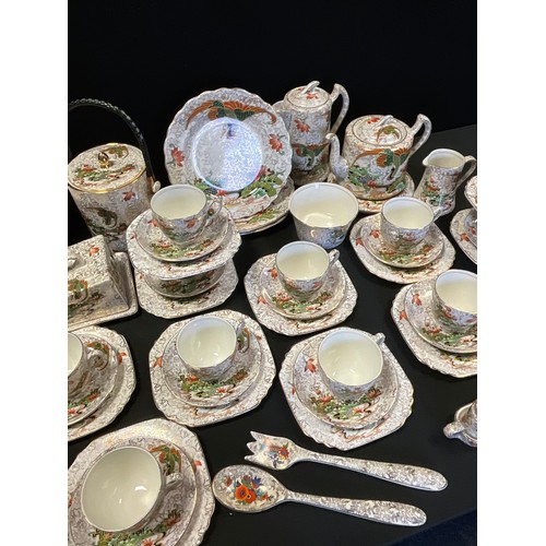 162 - A Phoenix ware tea set, for twelve inc teapot, hot water jug, biscuit barrel, straining bowl, cups, ... 