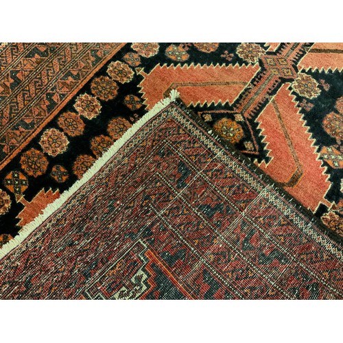 182 - A North-East Persian Meshed Belouch rug / carpet, 185cm x 90cm.