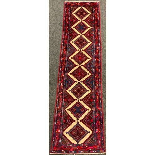 187 - A North-West Persian Hamadan Runner carpet, 263cm x 73cm.