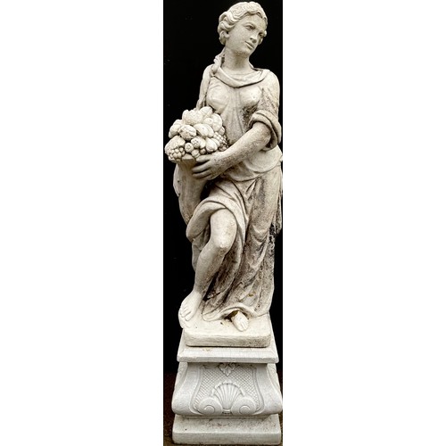 1769A - A large garden statue, of a lady, wearing flowing robes holding a fruiting cornucopia, on a pedestal... 