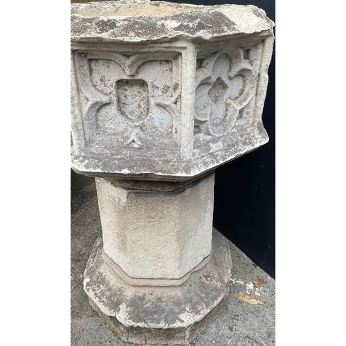 1769B - A 19th century carved stone and composition octagonal church font, carved with a gothic style tracer... 