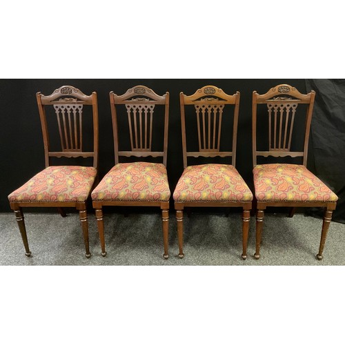 208 - A set of four late Victorian mahogany dining chairs, carved serpentine top rail, fret-work splats, s... 