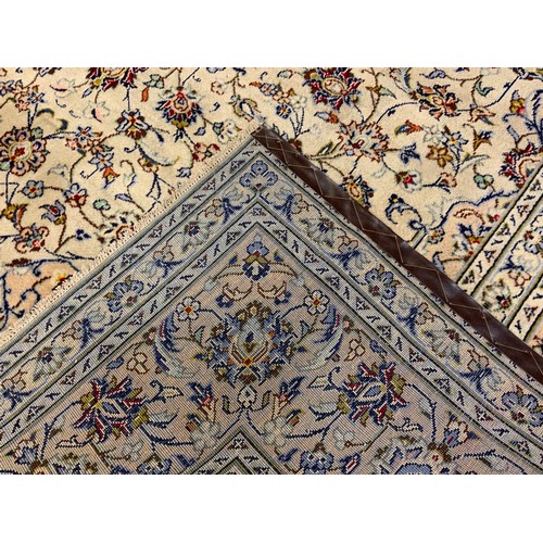 209 - A Central Persian Kashan carpet / rug, knotted in pale cream, blue and red, the intricate central me... 