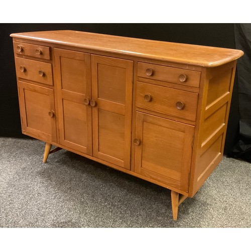 214 - A mid 20th century Ercol sideboard, elm plank top, two large and two small panelled doors, panelled ... 