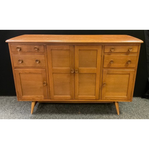 214 - A mid 20th century Ercol sideboard, elm plank top, two large and two small panelled doors, panelled ... 