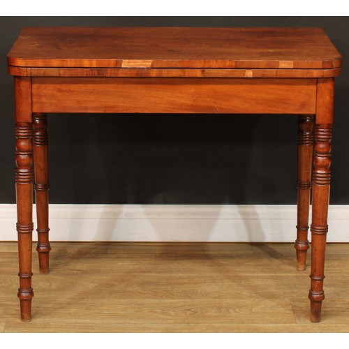 219 - A 19th century mahogany card table, hinged top enclosing a baize lined playing surface, ring-turned ... 