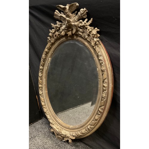 227 - A 19th century oval looking glass, 88cm x 57cm.