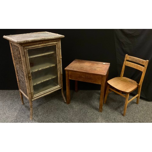 245 - A mid 20th century primary school desk with chair;  a Japanese bamboo and lacquer-work cabinet, (2).