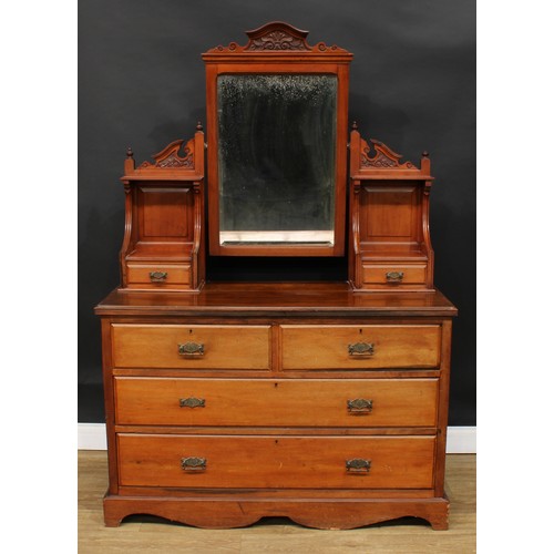 248 - A late Victorian walnut dressing chest, the superstructure with a mirror, open niches and small draw... 