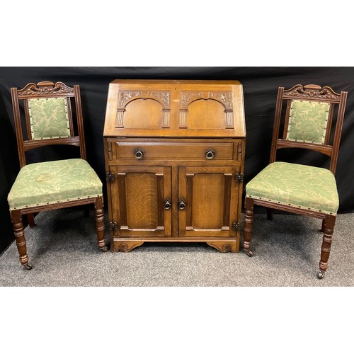 253 - A pair of Victorian oak hall chairs, carved cresting, upholstered backs and seats, turned legs, cera... 