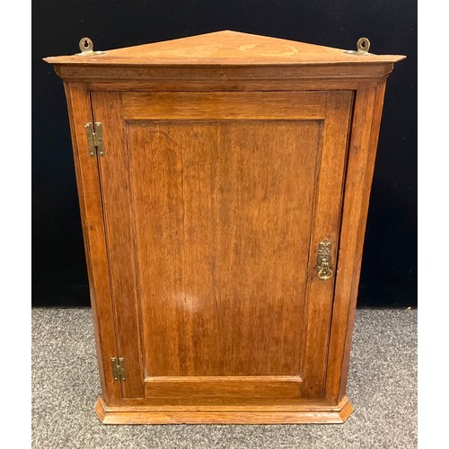 256 - A late 19th century George III style oak wall mounted corner cupboard, 85.5cm tall x 62.5cm wide x 3... 