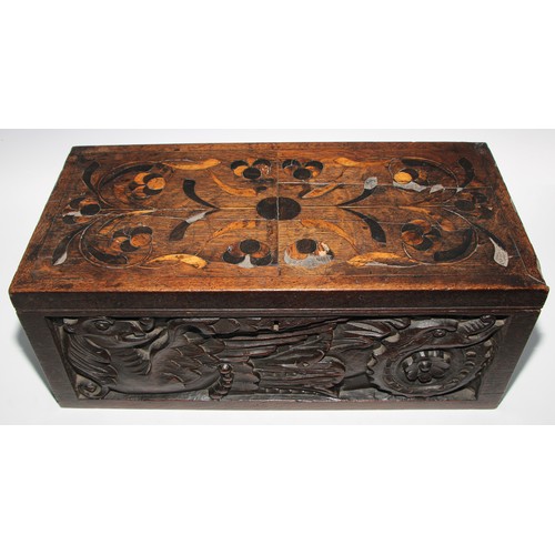 1624A - A large 19th century oak writing box, incorporating earlier panels, hinged cover inlaid in holly and... 