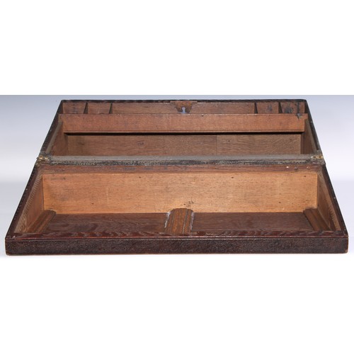 1624A - A large 19th century oak writing box, incorporating earlier panels, hinged cover inlaid in holly and... 