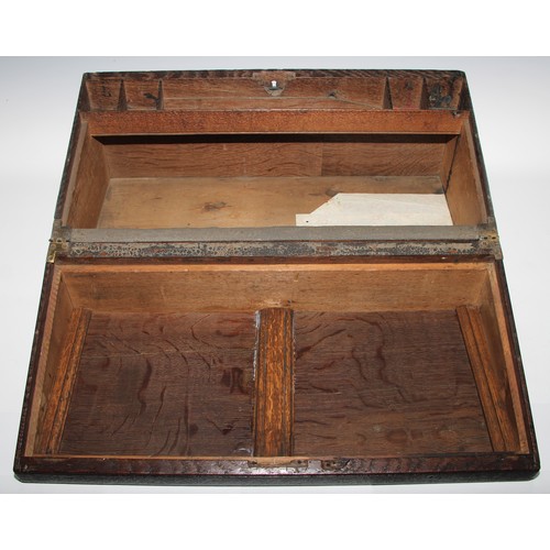 1624A - A large 19th century oak writing box, incorporating earlier panels, hinged cover inlaid in holly and... 