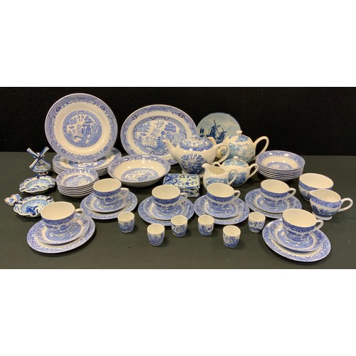 54A - A Barratts of Staffordshire blue and white ‘willow’ pattern dining service for six; Enoch Wedgwood t... 