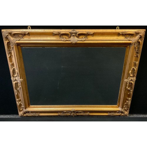 56A - A contemporary gilt framed wall mirror, bevelled glass, 90cm x 119cm overall.