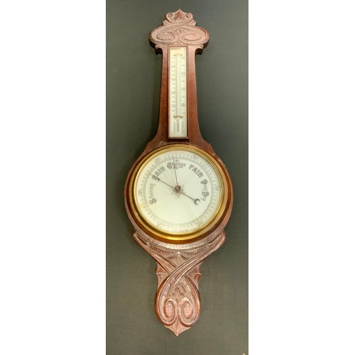 91A - An Art Nouveau carved cased aneroid Barometer Thermometer, 84cm high