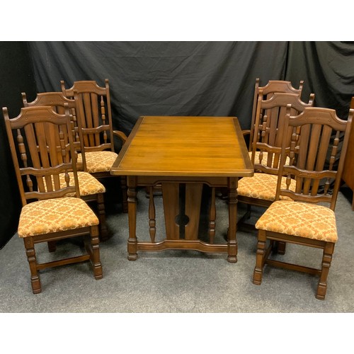 52 - A mid 20th century dinning suite, table and six chairs, the drawer leaf dinning table, with rectangu... 