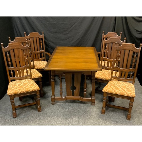 52 - A mid 20th century dinning suite, table and six chairs, the drawer leaf dinning table, with rectangu... 