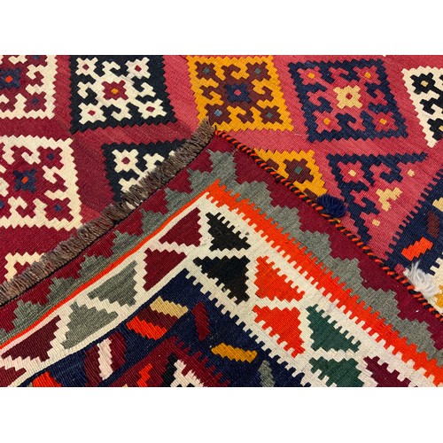 61 - A South-West Persian Qashgai Kilim rug / carpet, knotted with stylised geometric motifs in vibrant c... 