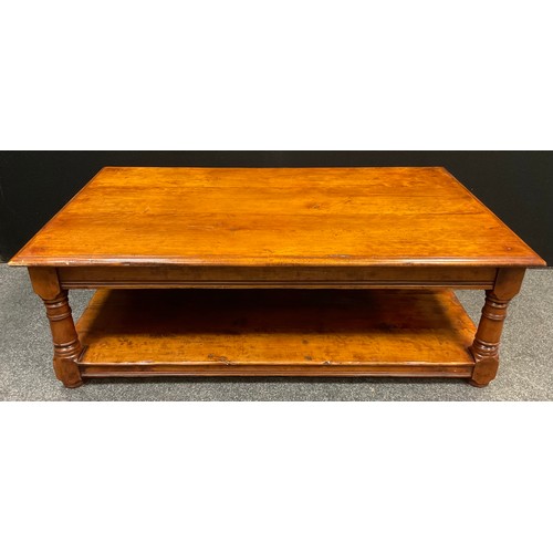 62 - A Titchmarsh and Goodwin style mahogany coffee table, slightly over-sailing top, turned supports, un... 