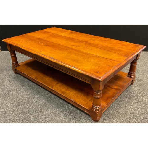 62 - A Titchmarsh and Goodwin style mahogany coffee table, slightly over-sailing top, turned supports, un... 