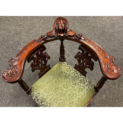 87 - A reproduction Italian Renaissance Revival carved mahogany corner chair, mask head top rail, carved ... 