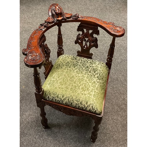 87 - A reproduction Italian Renaissance Revival carved mahogany corner chair, mask head top rail, carved ... 