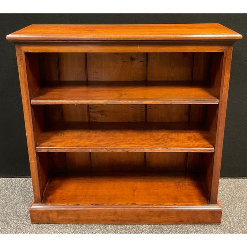 89 - A 20th century mahogany three-tier bookcase, 91.5cm tall x 91.5cm wide x 30.5cm deep.