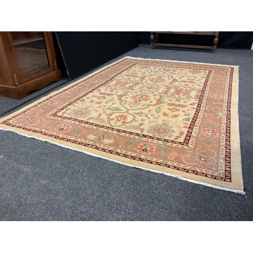 252 - A Persian Heriz silk and wool rug / carpet, knotted in subtle tones of brown, cream, and coral, with... 