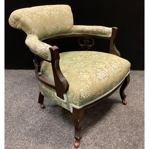 273 - A 19th century walnut, shield-back open arm chair, fleur-de-lys splat, stuffed-over seat, tapering s... 