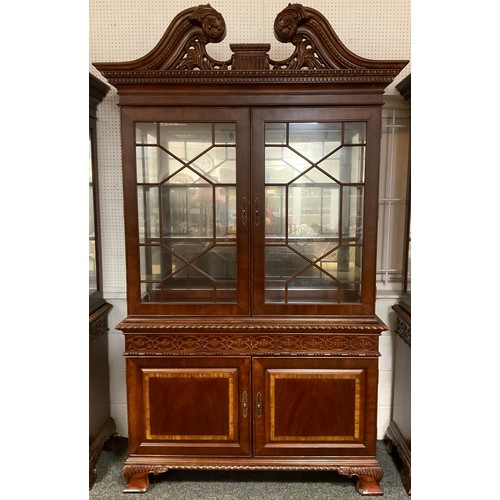 291 - A Georgian style, reproduction, bookcase cabinet, carved scroll cresting and cornice, pair of astral... 