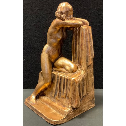 302 - An Art Deco style figure of a seated nude, cast plaster, 33cm tall.