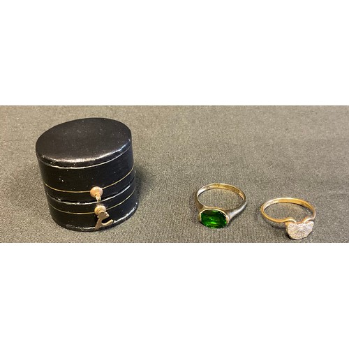 405 - A diamond chip ring, mounted in a fan, 18ct gold shank;   a green stone, 9ct gold shank