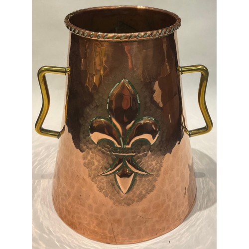 39 - An Arts and Crafts copper vase, embossed with coat of arms  and fleurs de lys, brass handles, 18.5cm... 