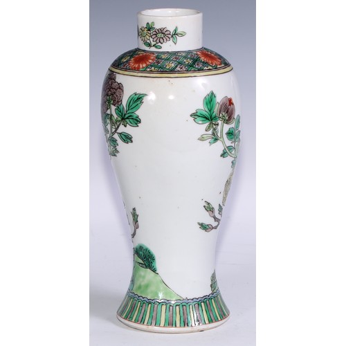 63 - A Chinese famille verte baluster vase, painted in polychrome with birds amongst chrysanthemums and p... 