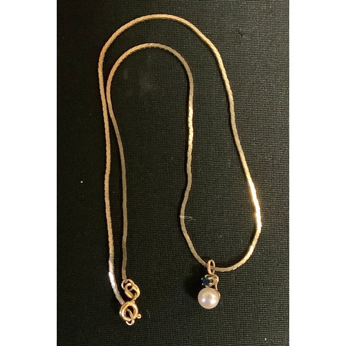 409 - A  9ct gold necklace, with pearl and sapphire pendant, 4g gross