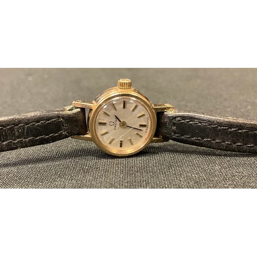 412 - A lady's 9ct gold Omega wristwatch, baton numbers, leather strap, c.1960