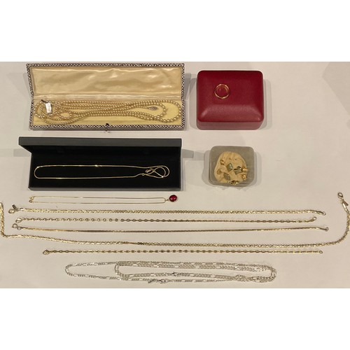 A 9ct gold necklace, red glass oval pendant; an 18ct gold fine chain