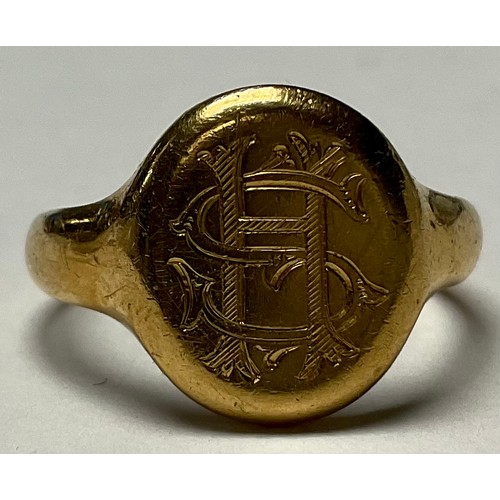 A George V 18ct gold signet ring, monogrammed SH, size R, Birmingham ...