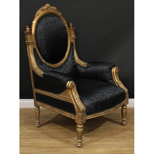 103 - A pair of bold Louis XVI design bergère à la reine or throne-form armchairs, stuffed-over upholstery... 