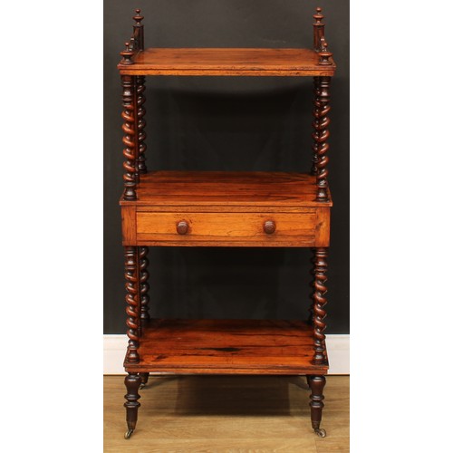 110A - A Victorian rosewood three-tier whatnot, the central plateau with a frieze drawer, spirally turned s... 