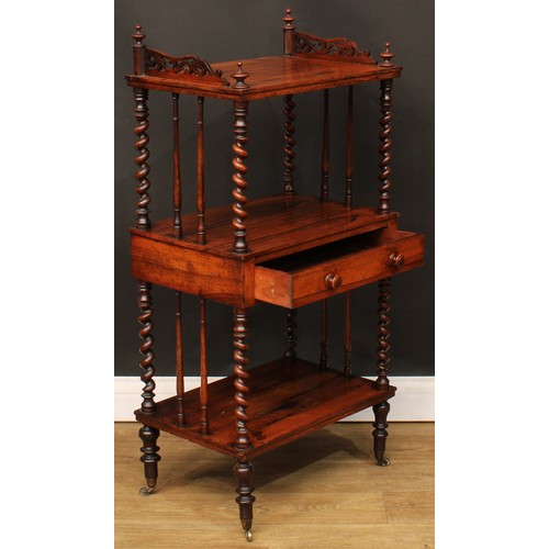 110A - A Victorian rosewood three-tier whatnot, the central plateau with a frieze drawer, spirally turned s... 