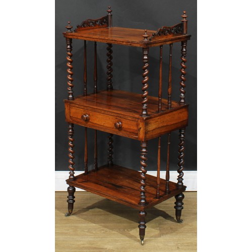 110A - A Victorian rosewood three-tier whatnot, the central plateau with a frieze drawer, spirally turned s... 