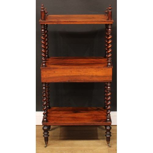 110A - A Victorian rosewood three-tier whatnot, the central plateau with a frieze drawer, spirally turned s... 