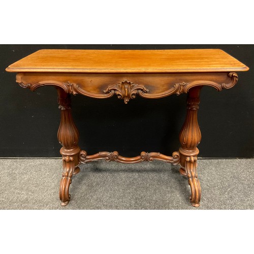 39 - A Victorian Rococo style carved mahogany centre table, rounded rectangular top, carved frieze, turne... 