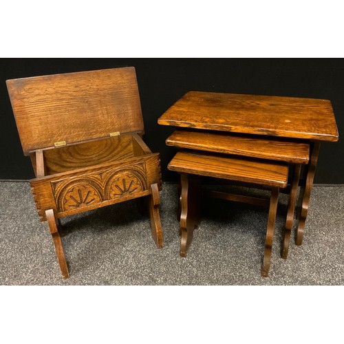 80 - A mid 20th century carved oak chest stool, 39cm tall x 44cm x 26.5cm;  a nest of three oak tables, t... 