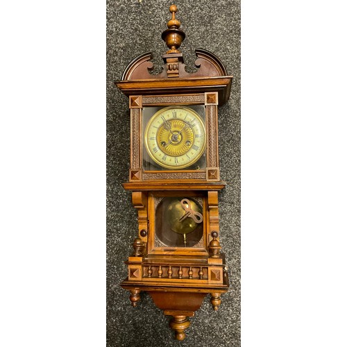 89 - A German walnut wall clock, Roman numerals, twin winding holes, the case with spire finial, glazed p... 